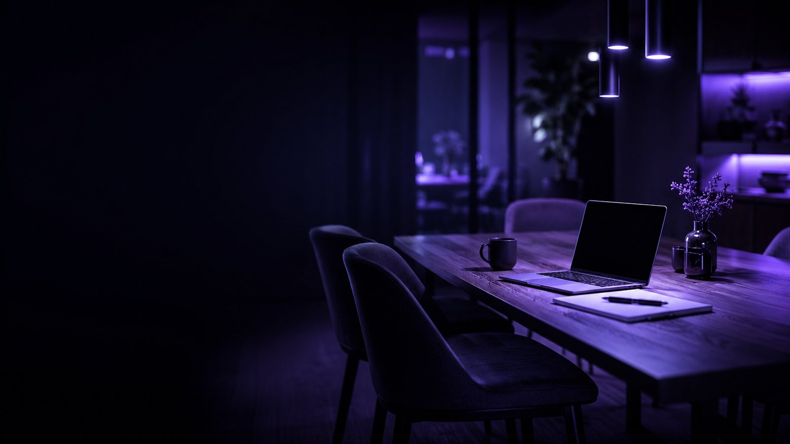 A home dining room quietly set up as a boardroom, lit in purple